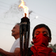 People hold torches during a march to demand justice for the murder of environmentalist and indigenous leader Berta Caceres, almost a month after her death.